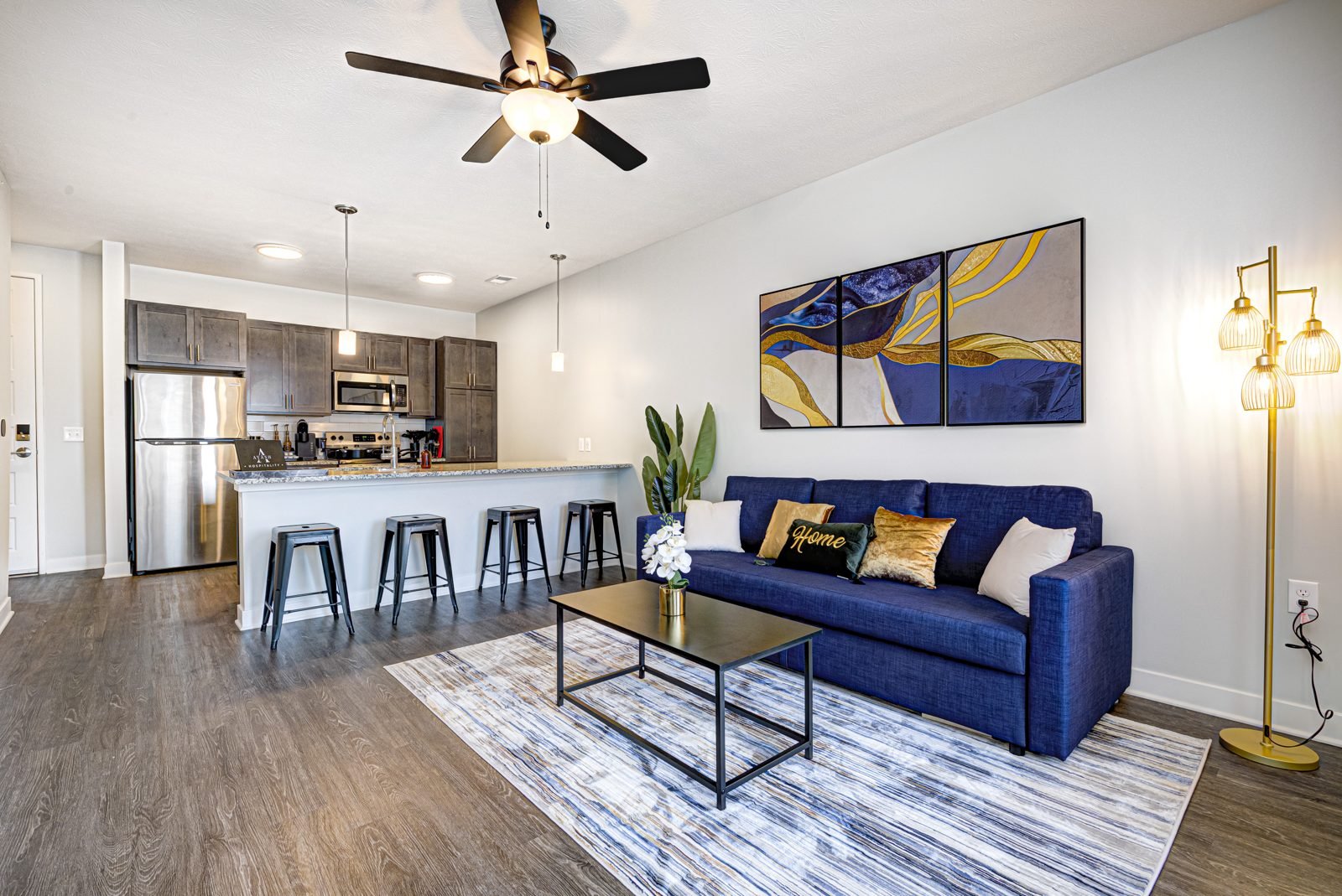 Furnished living room and kitchen of a corporate housing apartment
